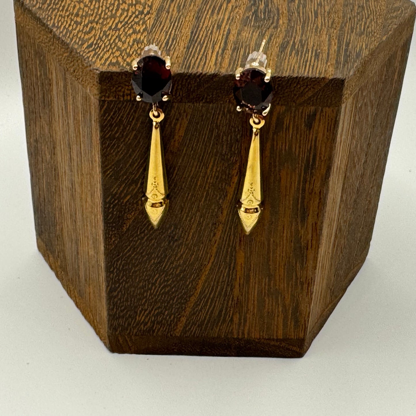 Gold stud earrings with amethyst gems and gold drops