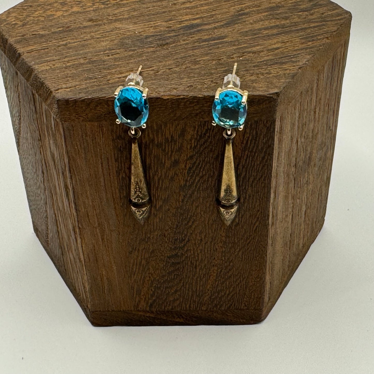 Gold studs with light turquoise gems and bronze drops