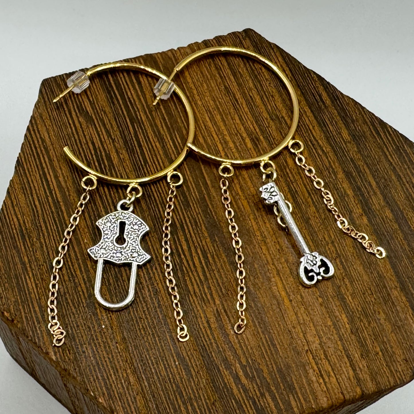 Gold hoop studs with lock and key