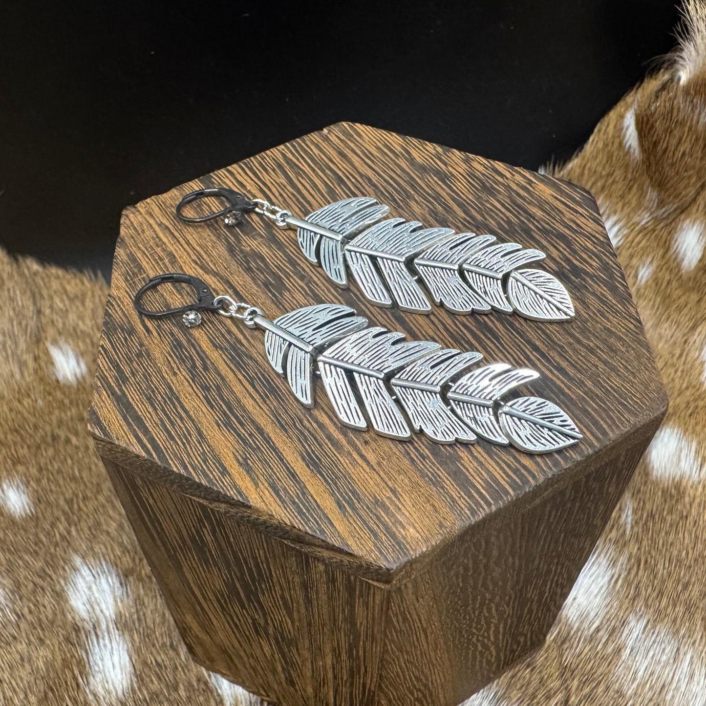Silver feather earrings with rhinestones