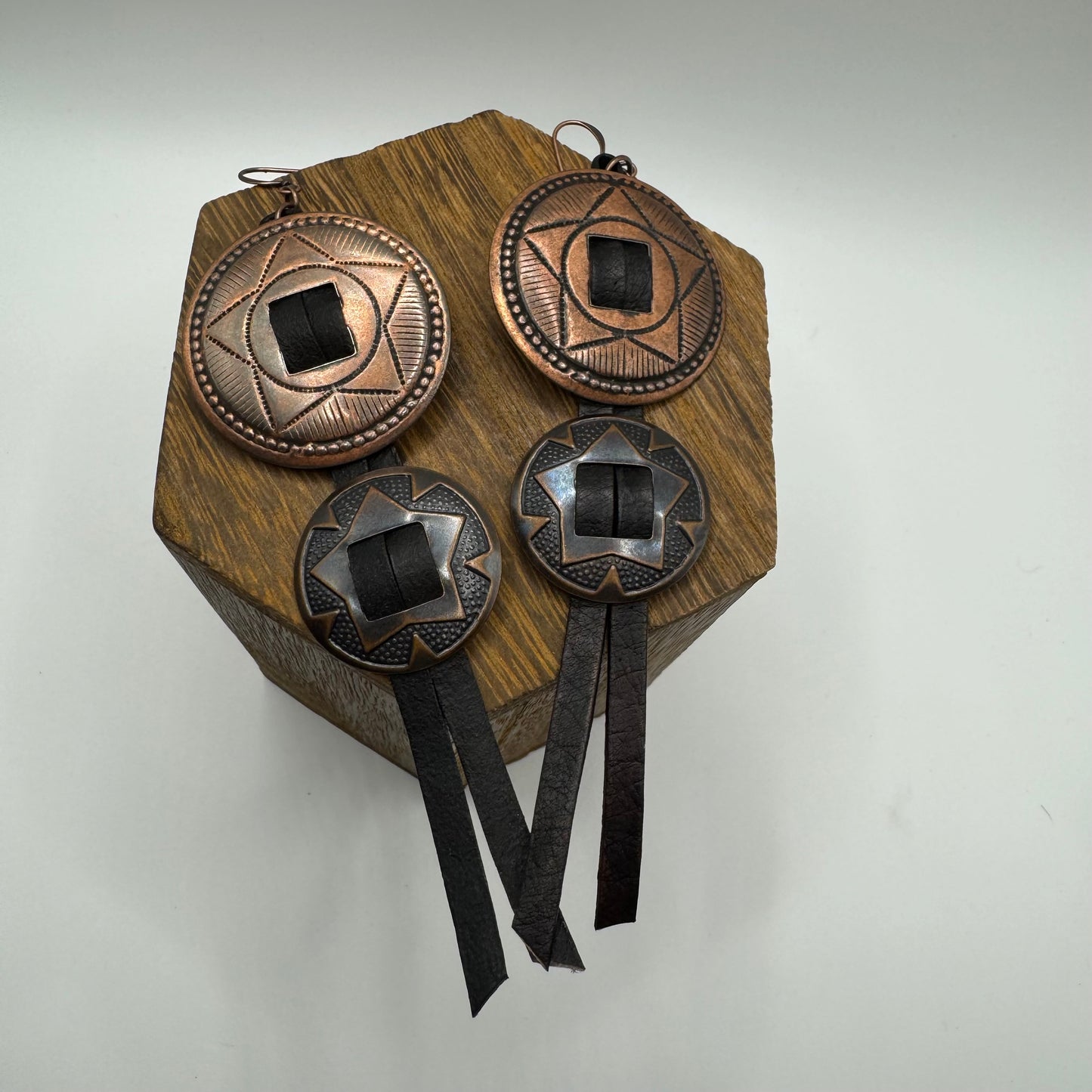 Concho earrings with black leather