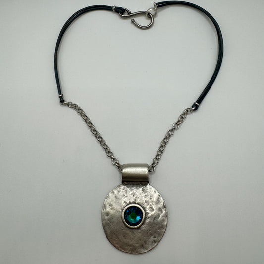 Hammered pendant with shimmering blue accent and silver/leather necklace