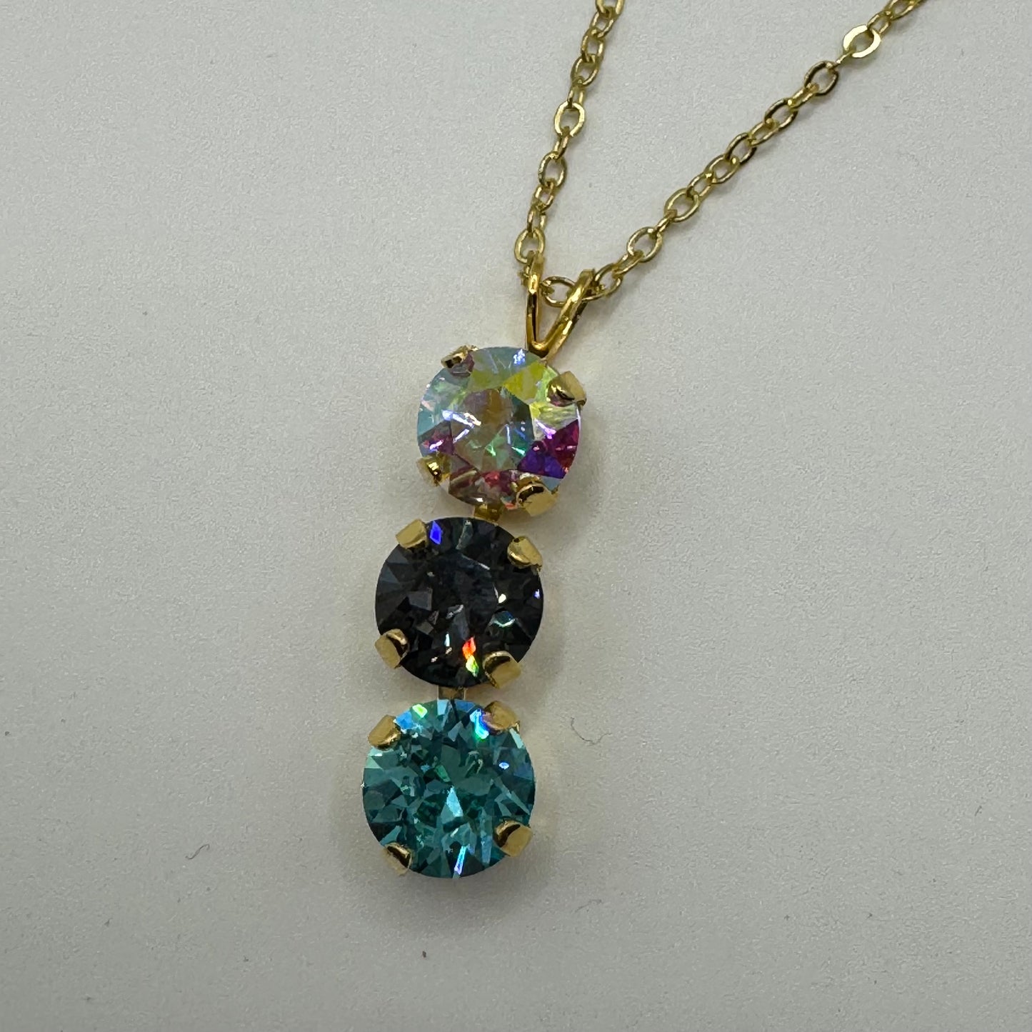Gold necklace with 3 gemstones