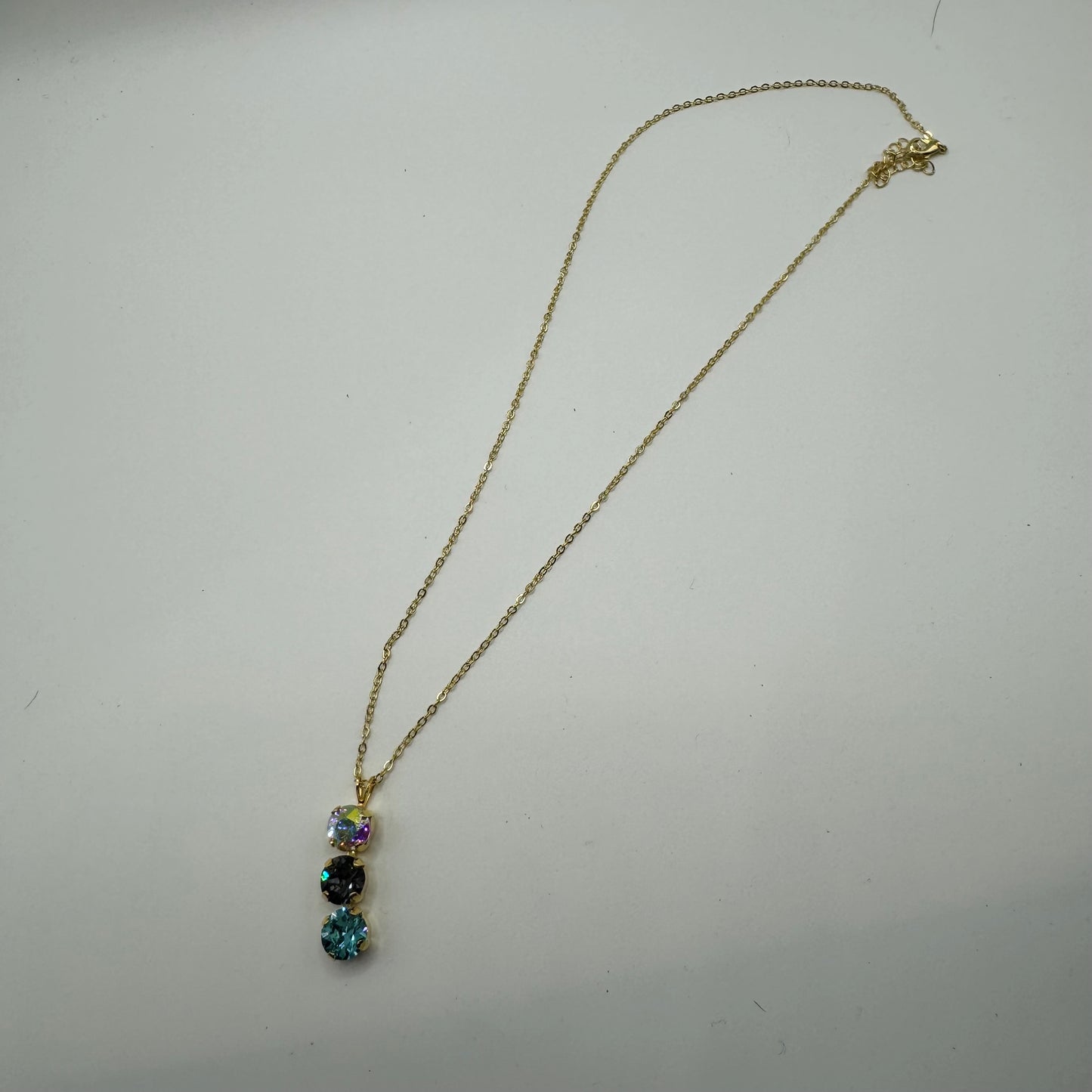 Gold necklace with 3 gemstones