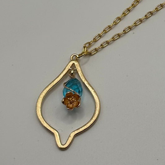 Gold marquise necklace with teal gem and gold flower
