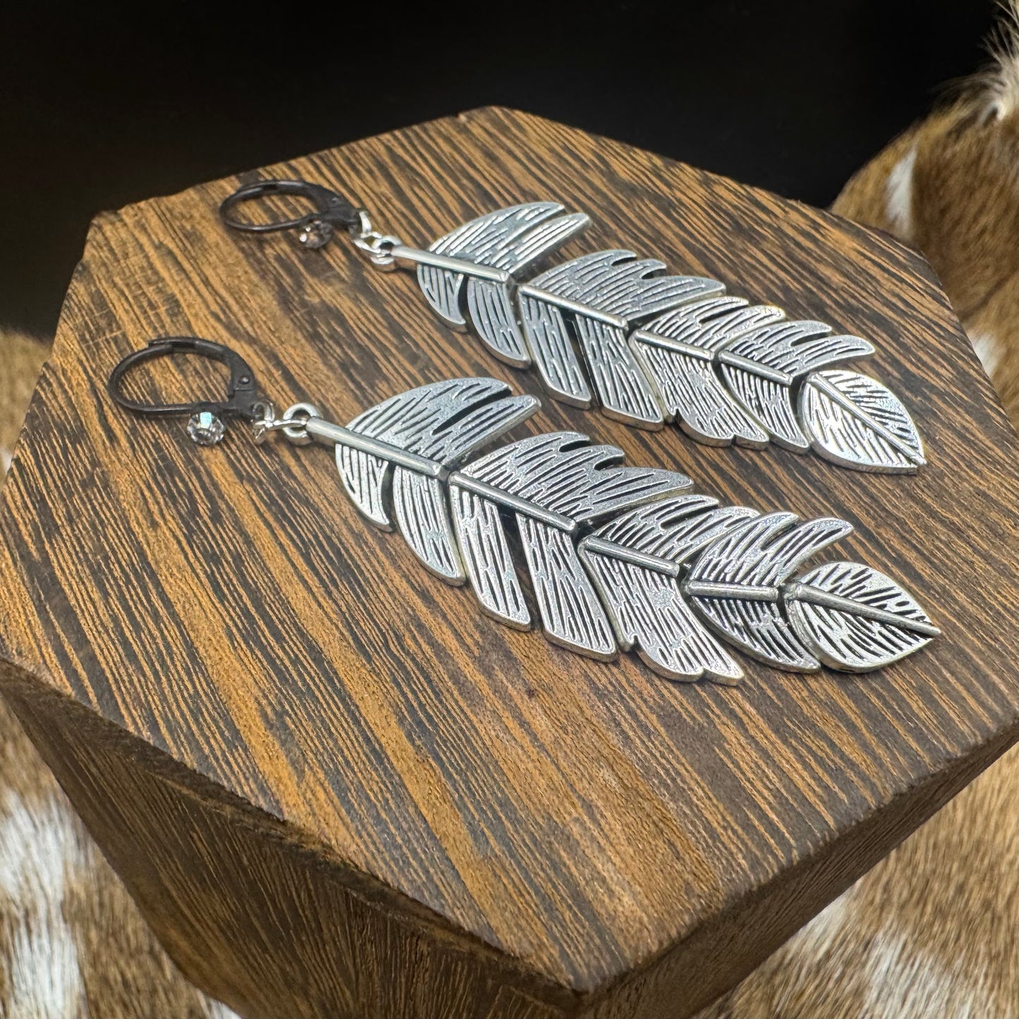Silver feather earrings with rhinestones